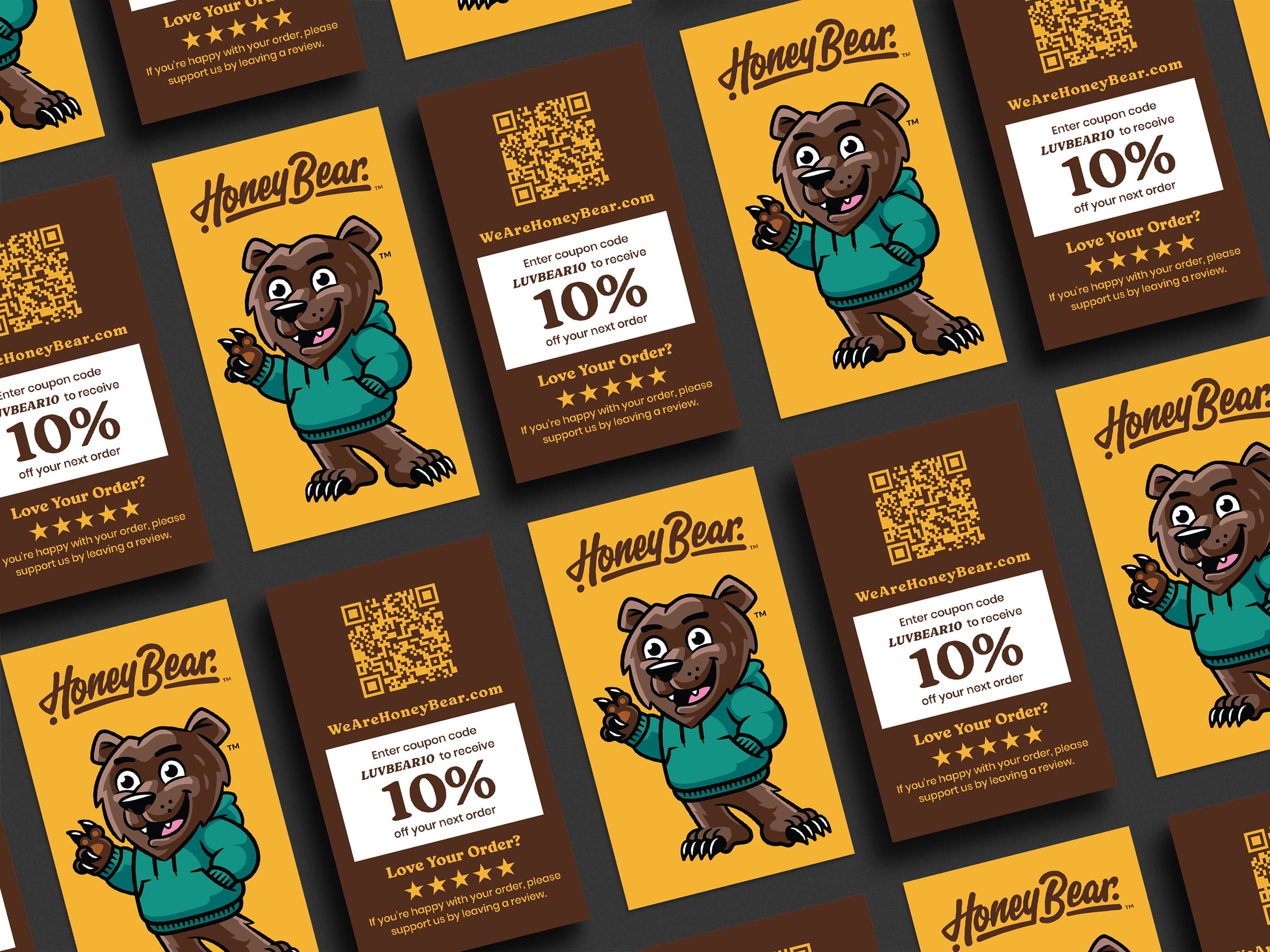 A side by side mockup showing the front and back of a Honey Bear business card. The front of the card features the brand mascot logo on a solid yellow background. The reverse side displays the website in a clean, legible layout that maintains the brand color palette.